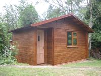 14 x 10 Studio, featuring a door in the recess and u-PVC windows. Customer has painted the building after assembly.