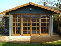 12 x10 Summer Room, featuring 15 pane georgian windows and sidelights. Customer has painted the building.