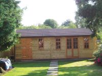 25 x 12 Orchard Room with Georgian doors and windows and an additional personal door. Brown felt tiles and a partition complete the building. 