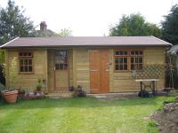 22 x 15 Studio-Store room, featuring 9 Pane door in recess. Personal door and 9 pane windows. A partition separates the two units. 