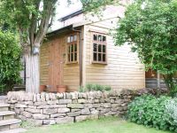 10 x 10 Store Room with a personal door and 2 x 9 pane windows.