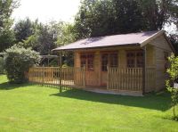 16 x 16 Pavilion with standard doors & windows. Additional felt tiles and extended decking area feature on this building.